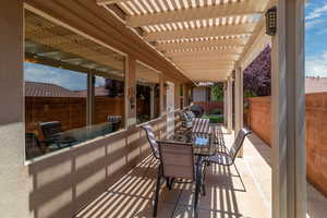 View of patio / terrace with outdoor dining area and a pergola