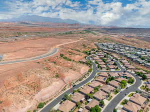 View of property location featuring a mountainous background and nearby suburban area