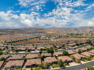 Aerial perspective of suburban area with a mountainous background