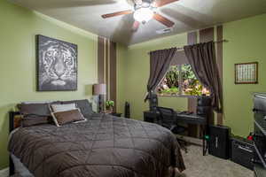 Bedroom featuring carpet flooring and a ceiling fan
