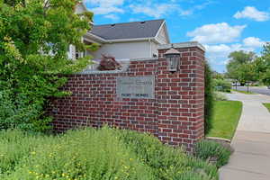 View of property exterior featuring stucco siding and roof with shingles