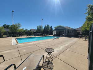 Community pool with a patio area
