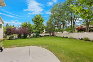 Fenced backyard featuring a patio area