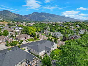 Aerial perspective of suburban area with a mountain backdrop