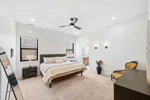 Bedroom featuring light colored carpet, recessed lighting, a ceiling fan, and ensuite bathroom