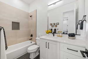 Bathroom with vanity and shower / bathtub combination