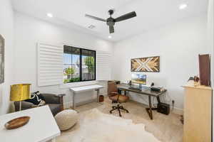 Office area with a ceiling fan, carpet flooring, and recessed lighting