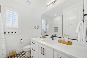 Full bathroom with vanity and a shower with shower curtain