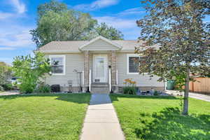 Bungalow-style house with a shingled roof