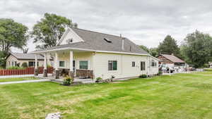 Rear view of house with roof with shingles