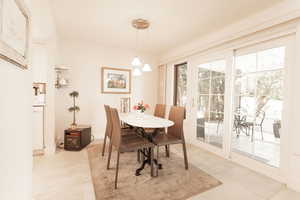 Dining area featuring light tile patterned floors