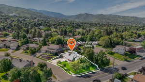 Aerial view of residential area with a mountain backdrop