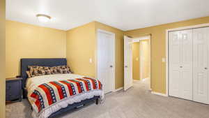 Bedroom with carpet flooring and a closet