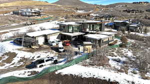 Snowy aerial view with a mountain view