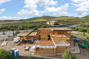 View of subject property featuring a mountainous background