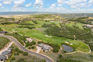 View of property location with a water and mountain view and a golf course