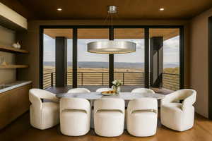 Dining area featuring plenty of natural light, wood finished floors, and recessed lighting