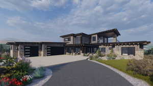 Contemporary home featuring stone siding, driveway, a garage, and board and batten siding