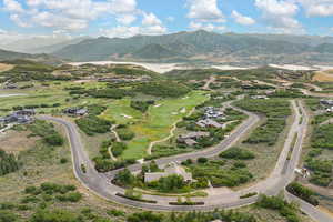 Drone / aerial view of mountains and a local golf course