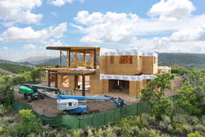 Back of house with a mountain view