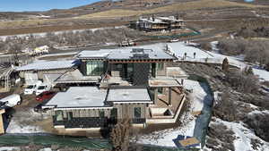 Snowy aerial view with a mountain view