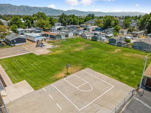 Aerial view of residential area featuring a mountainous background