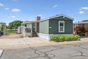Manufactured / mobile home featuring a shed