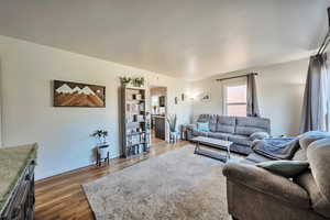 Living area featuring wood finished floors and baseboards