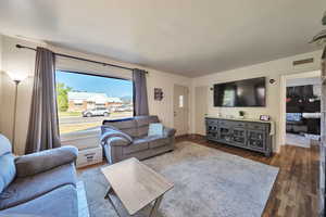 Living room featuring wood finished floors