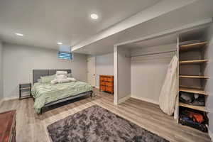 Bedroom featuring wood finished floors and recessed lighting