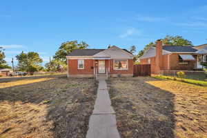 Bungalow-style home featuring brick siding