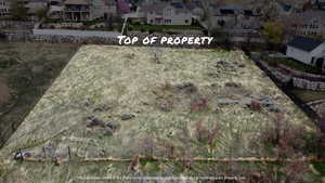 Aerial overview of property's location with nearby suburban area