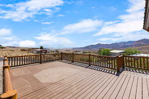 Wooden deck featuring a mountain view
