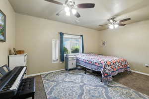Bedroom featuring carpet floors and ceiling fan