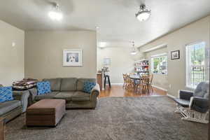 Living room with wood finished floors and carpet floors