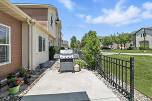 View of patio / terrace featuring a grill and a residential view