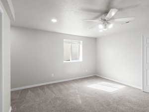 Bedroom featuring carpet floors, ceiling fan, a textured ceiling, and recessed lighting
