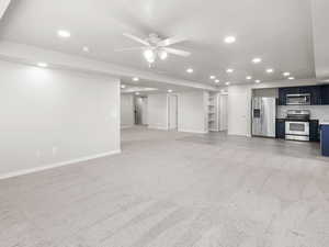 Living room featuring light carpet, recessed lighting, and ceiling fan