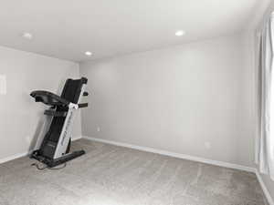Workout area featuring carpet floors and recessed lighting