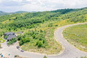 Lot rises from North side to South  then  upper road side slopes to east