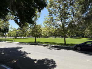 View of home's community with a yard