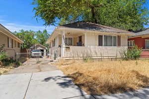 Bungalow-style house with driveway and a garage
