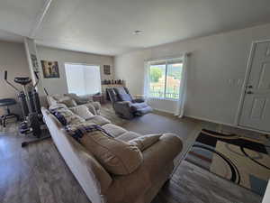 Living room featuring wood finished floors and baseboards