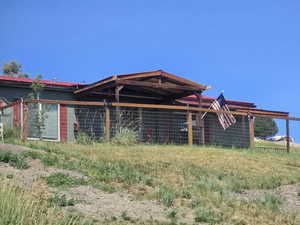 Rear view of house with concrete block siding