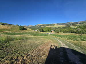 View of mountain backdrop featuring rural landscape