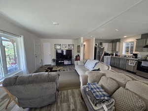 Living room with wood finished floors and baseboards