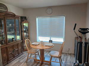 Dining space with light wood-style floors
