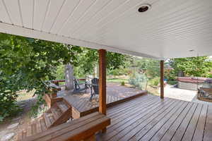 Wooden deck featuring a hot tub