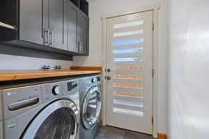 Washroom with washer and dryer and cabinet space
