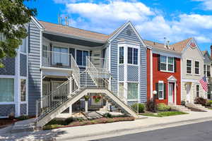 View of property featuring stairway